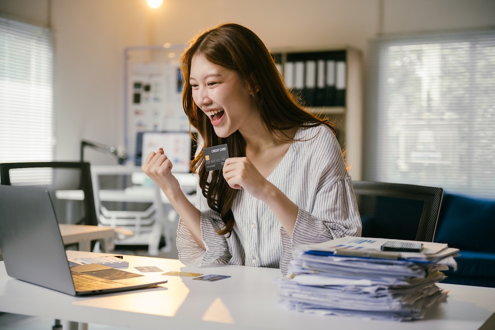 Happy person working at desk with secure task management